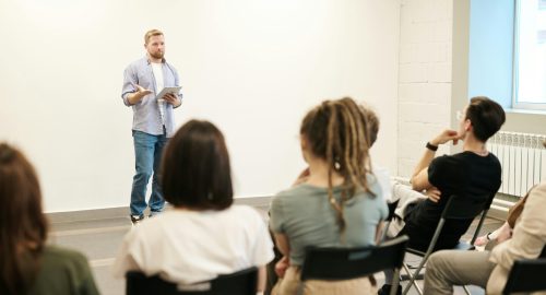 pexels-fauxels-3184317 a man speaking in front of the whole class
